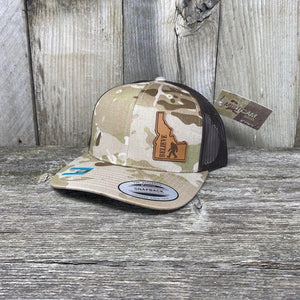BIGFOOT IDAHO LEATHER PATCH HAT FLEXFIT Leather Patch Hats Hells Canyon Designs # Arid/Brown Multi-cam