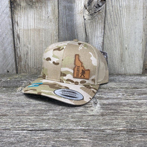 BIGFOOT IDAHO LEATHER PATCH HAT FLEXFIT Leather Patch Hats Hells Canyon Designs # Arid/Tan Multi-cam