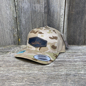 HAND SEWN BLACK ELK SHED LEATHER PATCH HAT - FLEXFIT SNAPBACK Leather Patch Hats Hells Canyon Designs # Arid/Tan Multicam
