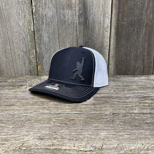 BIGFOOT SHAKA BLACK LEATHER PATCH HAT - RICHARDSON 112 Leather Patch Hats Hells Canyon Designs # Black/White 