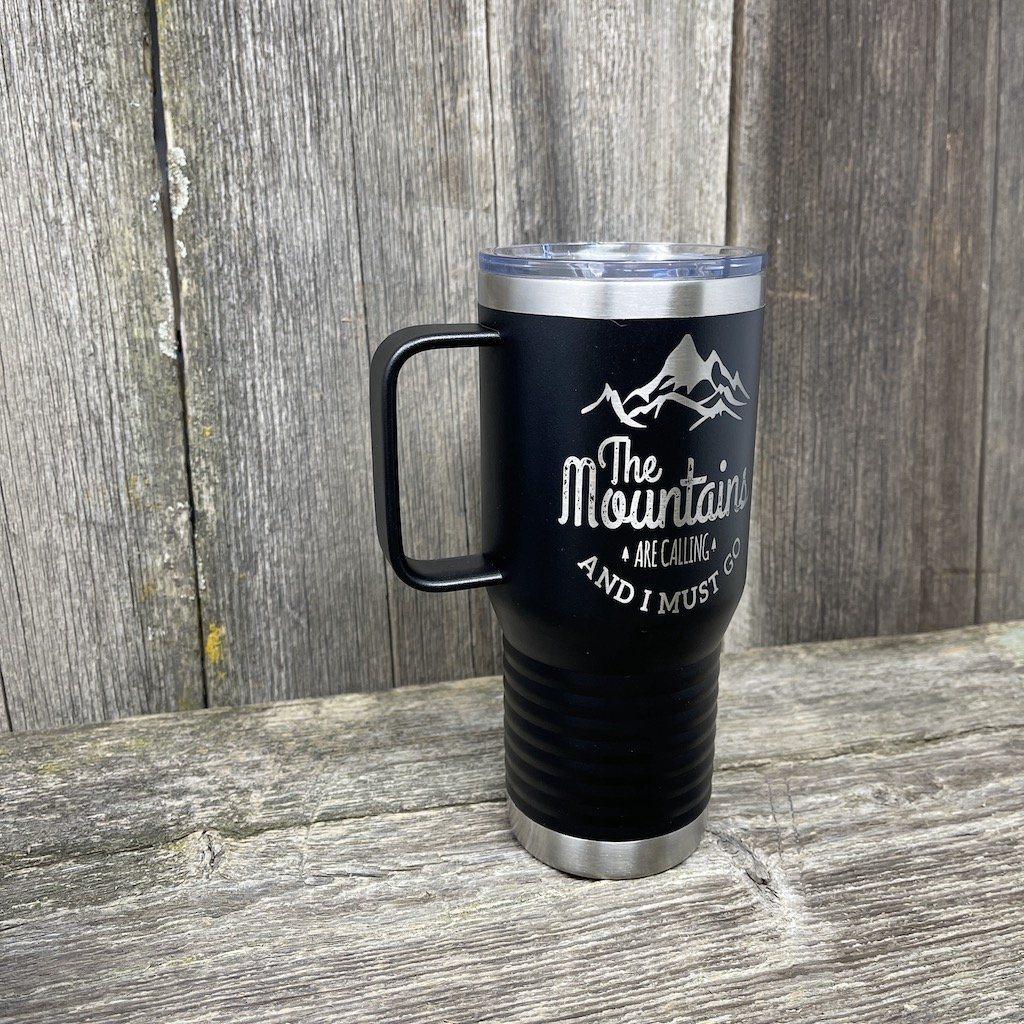 https://www.hellscanyondesigns.com/cdn/shop/products/mountains-are-calling-20oz-coffee-cup-tumbler-hells-canyon-designs-843206_1200x.jpg?v=1618887293